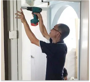 Worker dismantling PVC Frame process