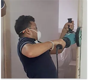 Worker dismantling Metal Frame process