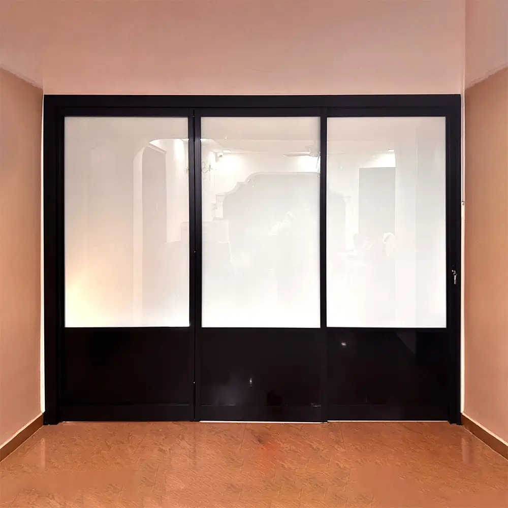 #10 Black Top Hung Aluminium Framed 3 Panel Folding Door (VG2840) with Slide to Fold System and Classy Invisible VG Hinge in Design o1 with Panel A: Design Glass LFG Laminated Safety Frosted Glass and Panel B: AL PE9952 Black matt coloured, smooth Waterproof Aluminium panel material for Bathroom