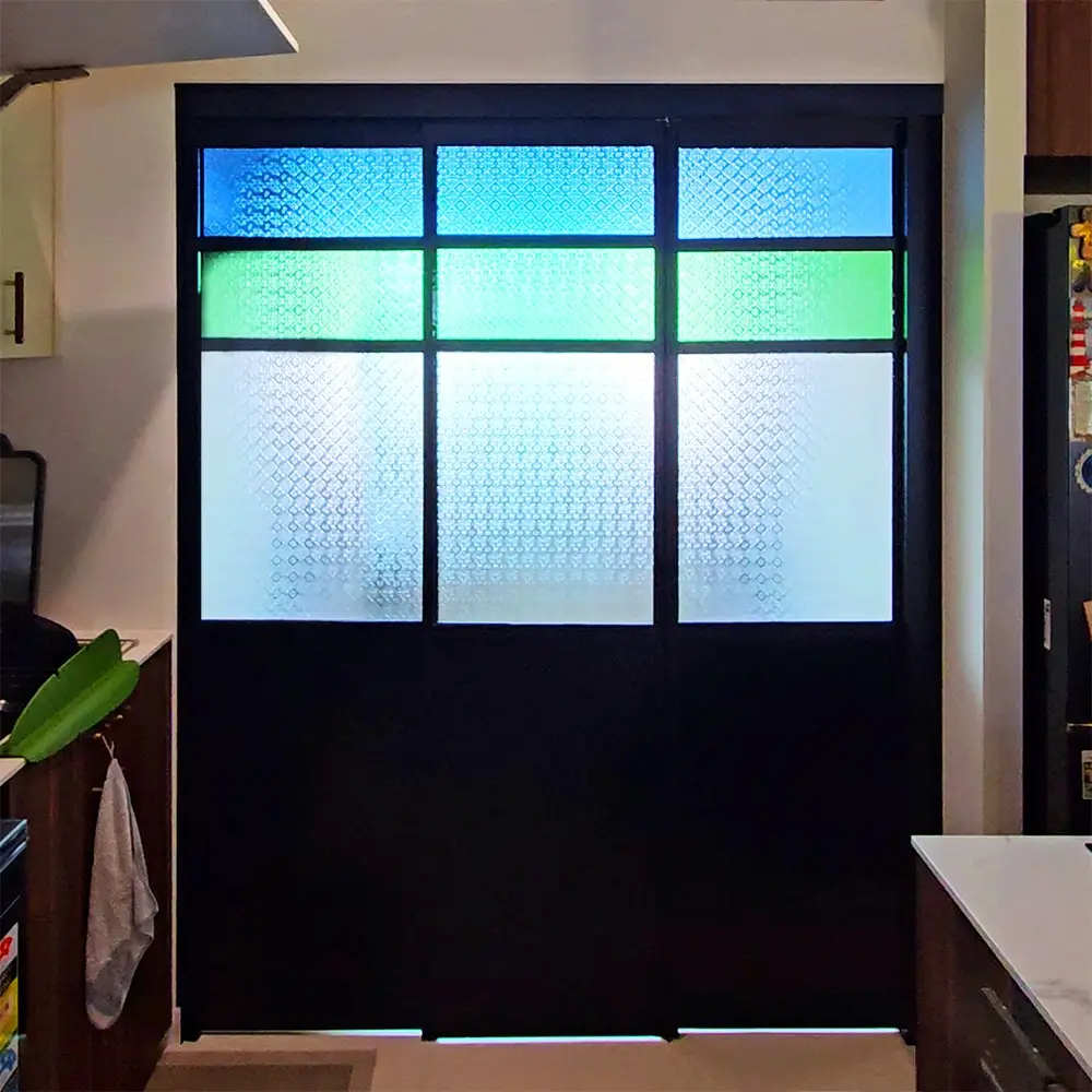 #10 Black Top Hung Aluminium Framed 3 Panel Folding Door (VG2622) with Slide to Fold System and Classy Invisible VG Hinge in Custom Design with Panel A: Design Glass BFG Blue Floral Glass, Panel B: Design Glass GFG Green Floral Glass and Panel C: Design Glass CFG Clear Floral Glass for Kitchen